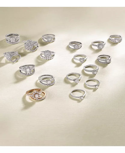 Stunning 1/2 Ct. T.W. Diamond Halo Engagement Ring in Elegant 14K White Gold